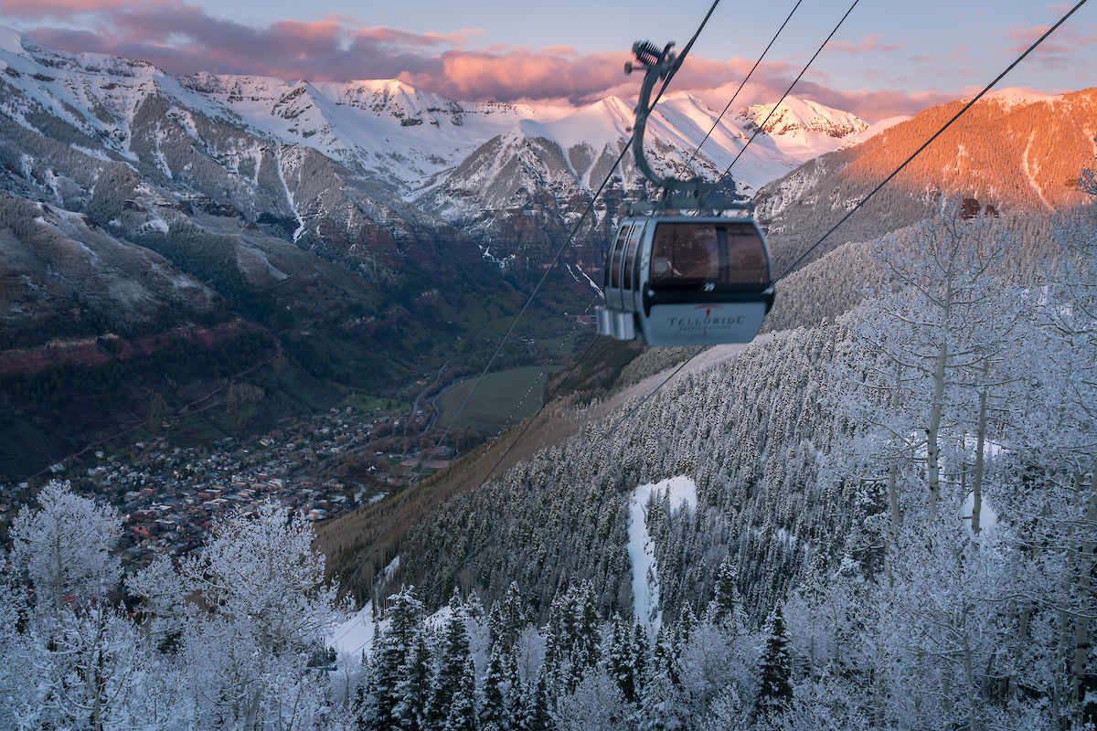 Telluride gondola in fall with snow capped peaks